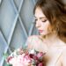 Closeup brunette bride with fashion wedding hairstyle and makeup