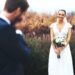 Shot of a bridegroom crying while looking at his beautiful bride on their wedding day