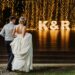 Young couple at their wedding walking towards the reception
